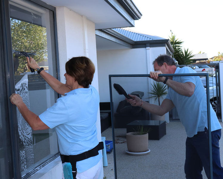 window cleaning team, washing windows and fly-screens.